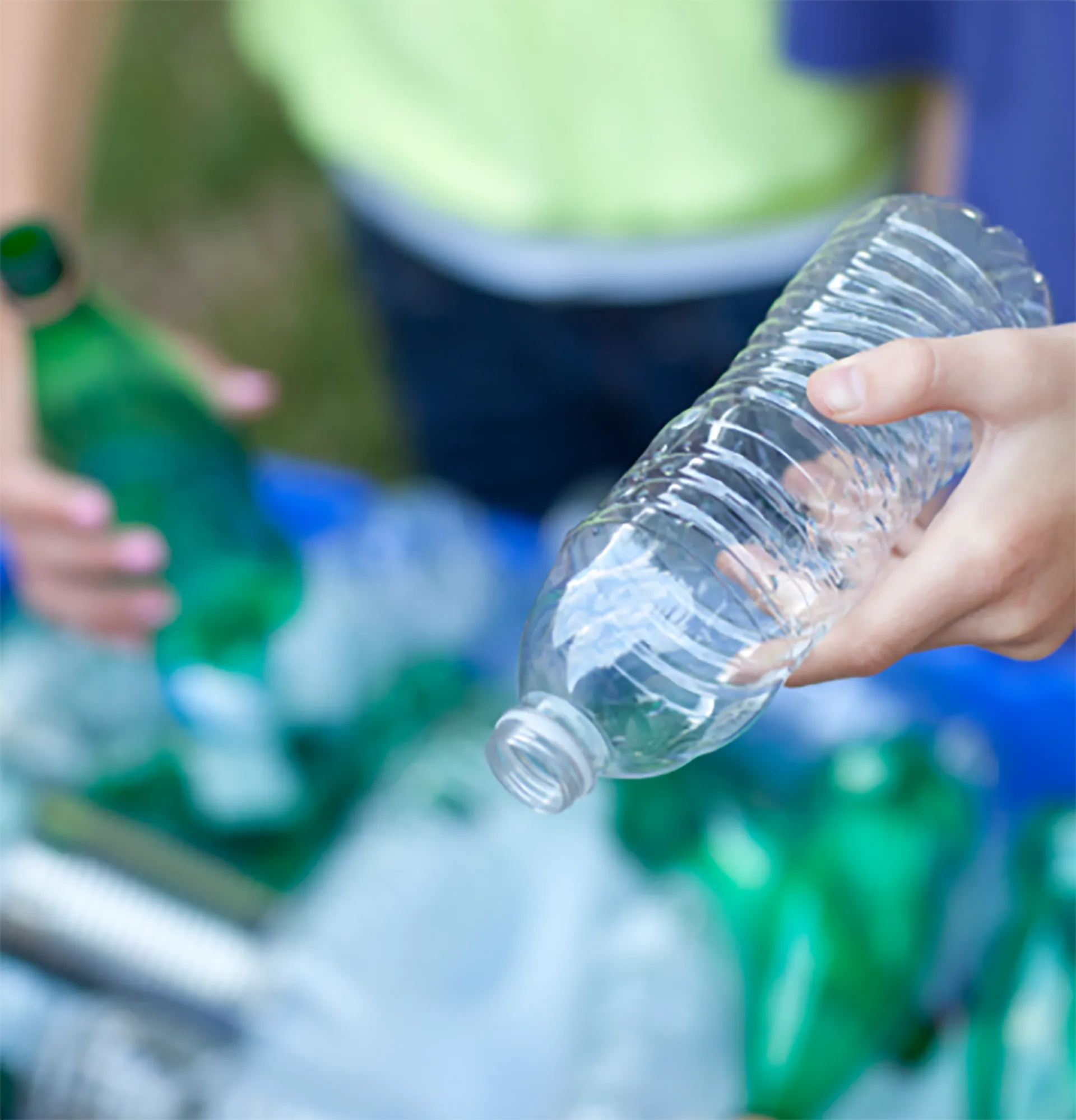 image of a plastic bottle being taken to a plastic waste recycling facility