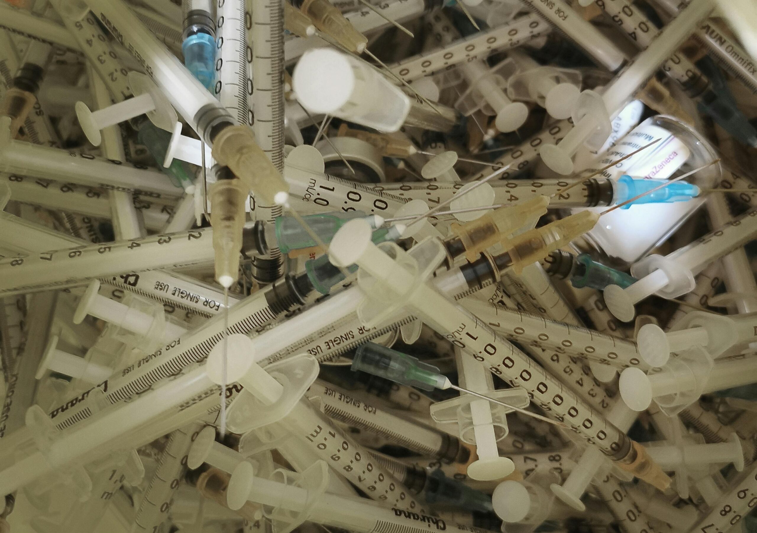 syringes in a hazardous waste disposal bin