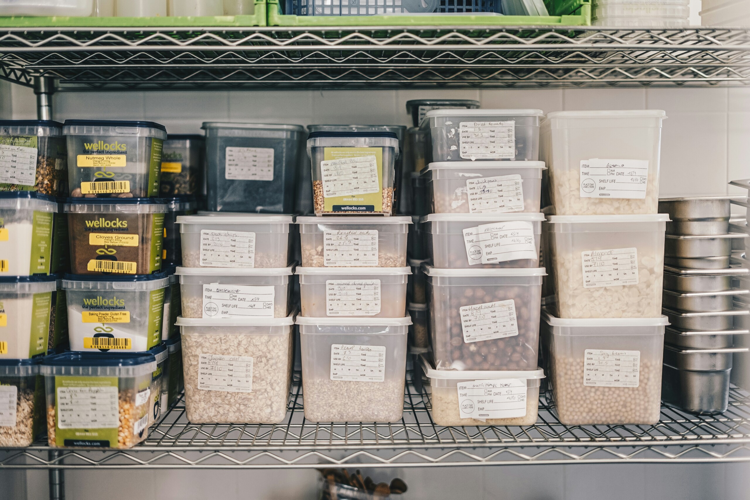Rows of plastic containers with food used in a restaurant