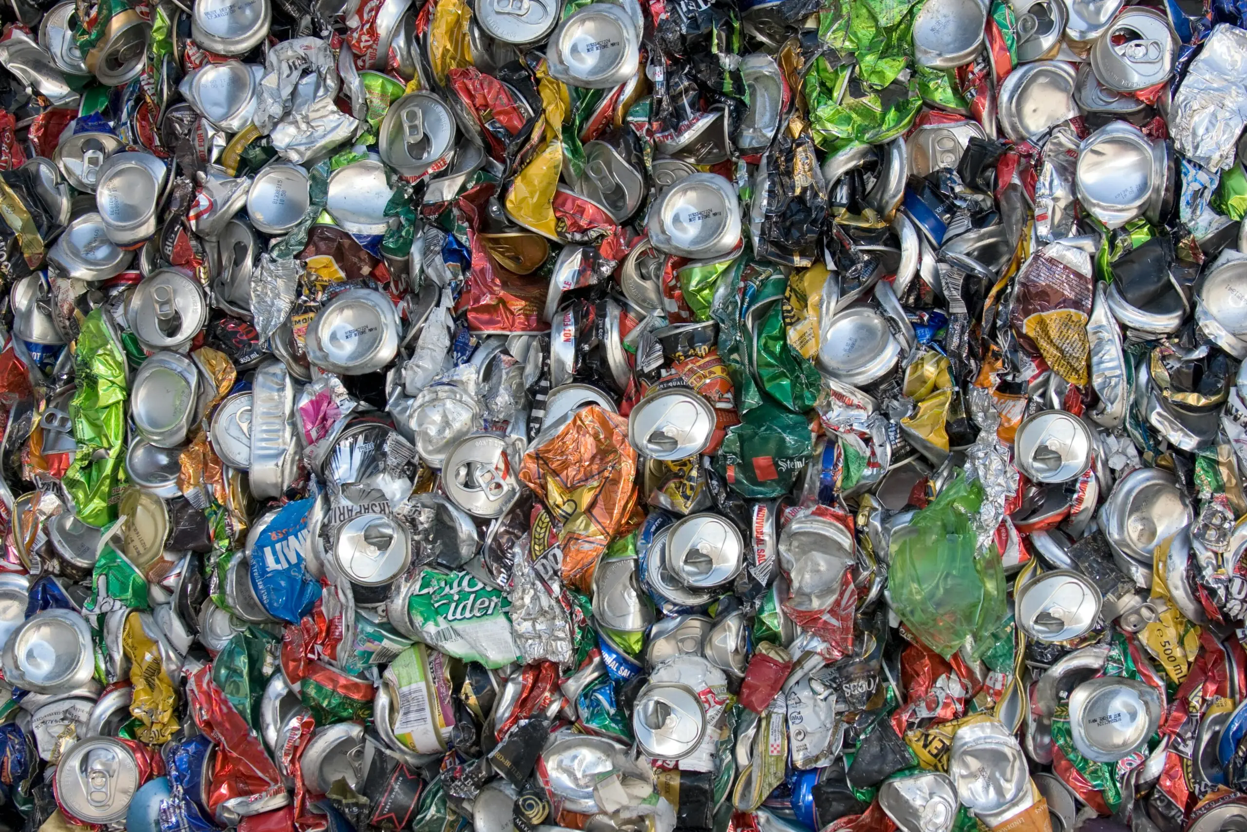 Metal cans flattened and ready to be recycled at a metal waste facility