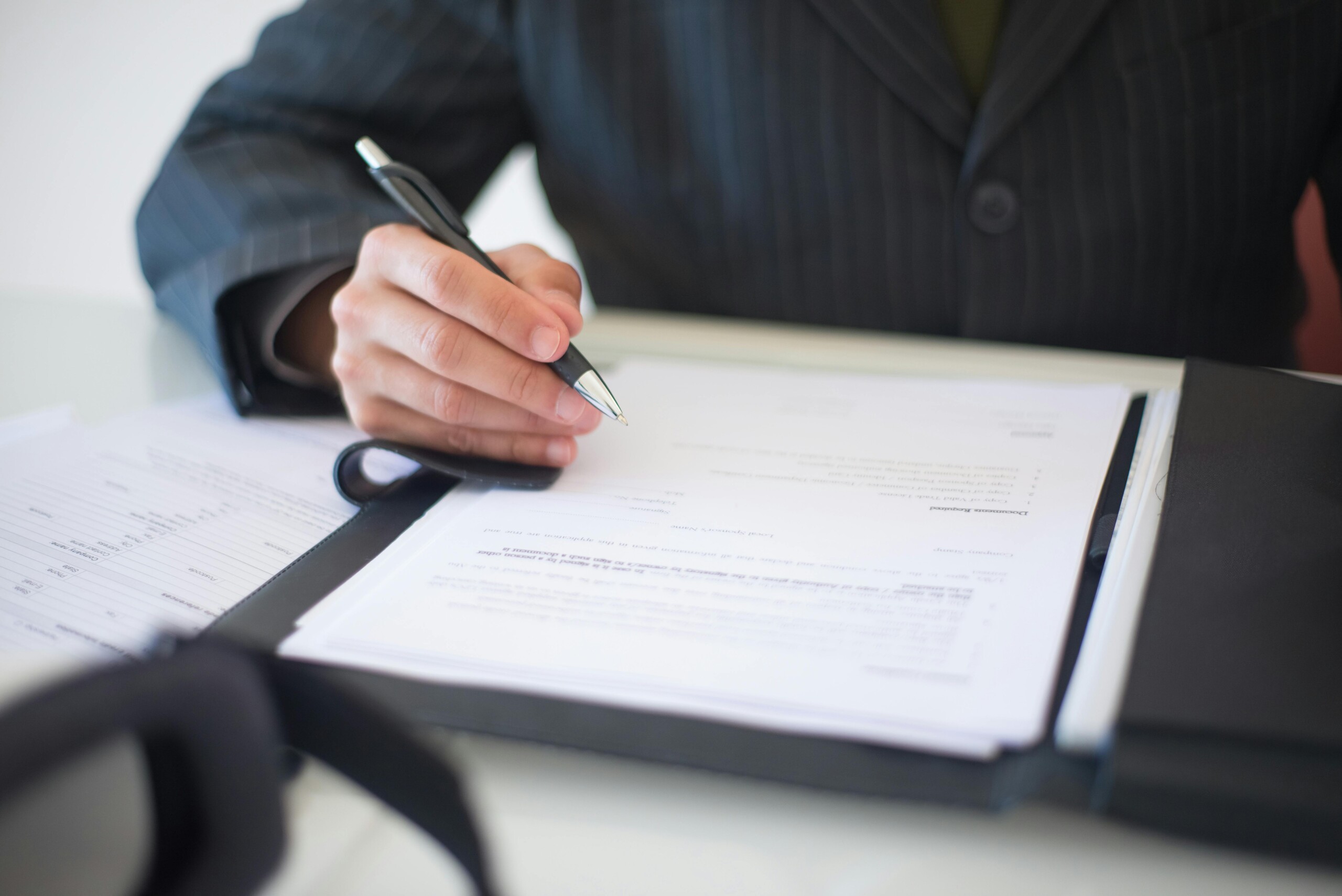 An official filling out a BREAM certification form for a new construction project