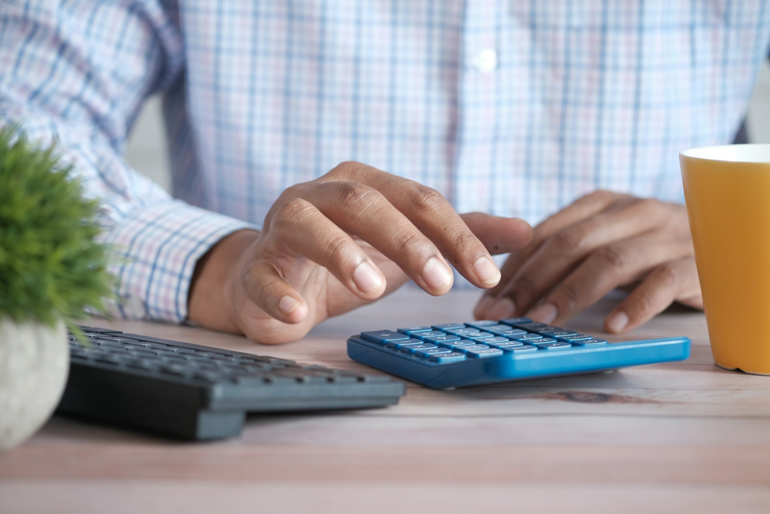 Business man calculating his plastic packaging tax rate